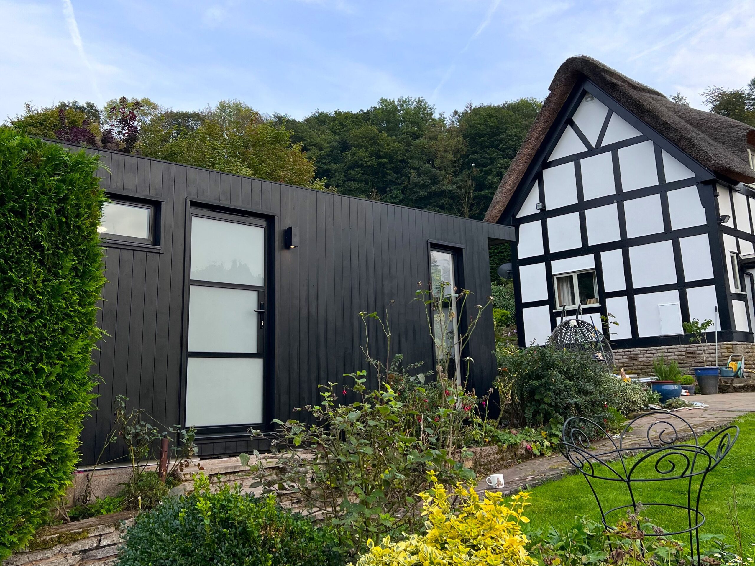 Garden room in a traditional English garden built in line with planning permission for garden rooms
